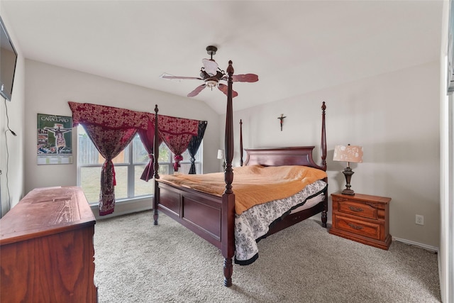 carpeted bedroom featuring ceiling fan and vaulted ceiling