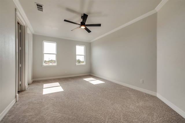 unfurnished room with ornamental molding, ceiling fan, and carpet flooring