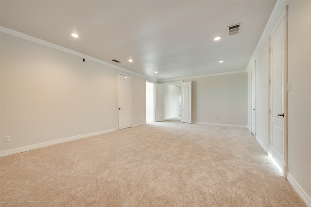 carpeted spare room with crown molding