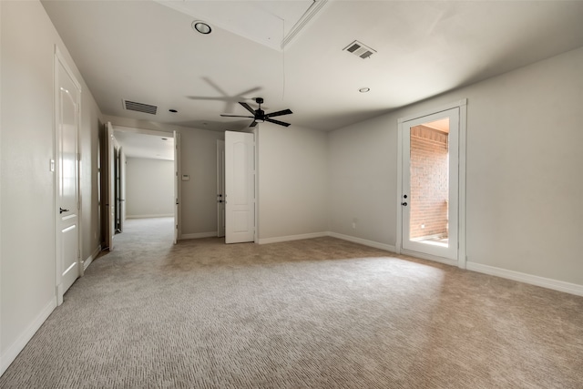 unfurnished room featuring light colored carpet and ceiling fan