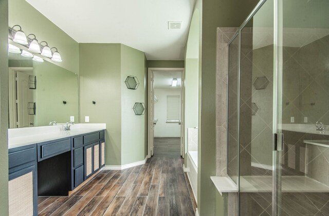 bathroom featuring vanity and an enclosed shower