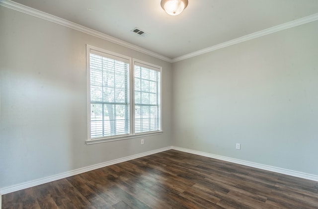 spare room with crown molding and dark hardwood / wood-style flooring