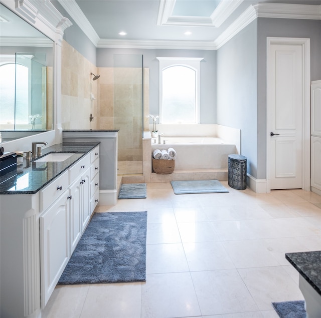 bathroom featuring tile patterned floors, vanity, separate shower and tub, and ornamental molding