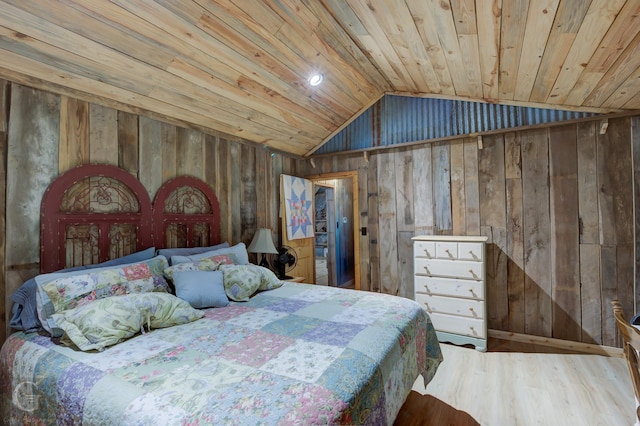 bedroom with hardwood / wood-style flooring, wood walls, wood ceiling, and vaulted ceiling