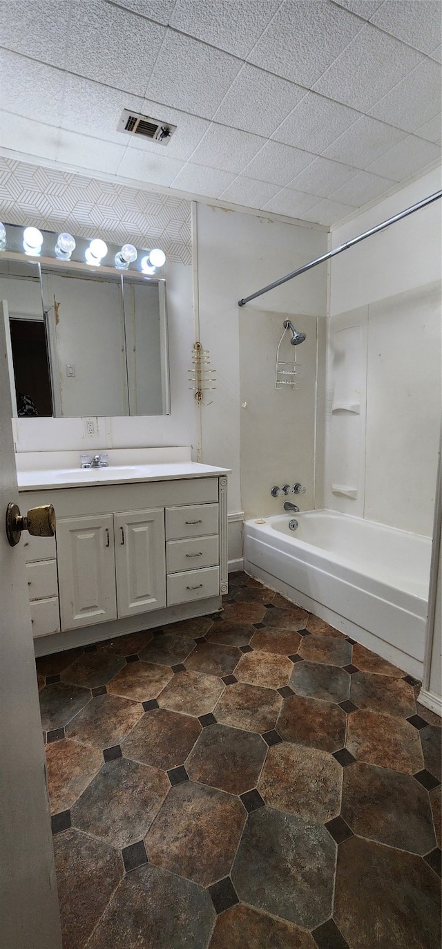 bathroom featuring shower / bath combination, vanity, and tile patterned floors