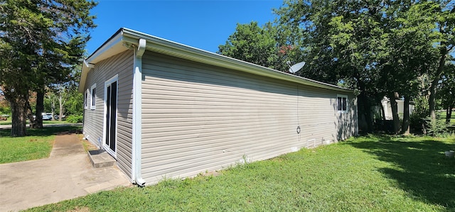 view of home's exterior with a yard