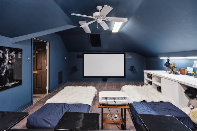 carpeted cinema with ceiling fan and lofted ceiling