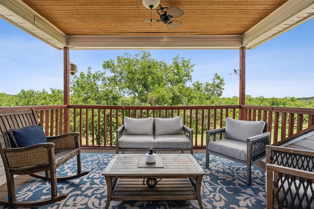 deck featuring an outdoor hangout area and ceiling fan