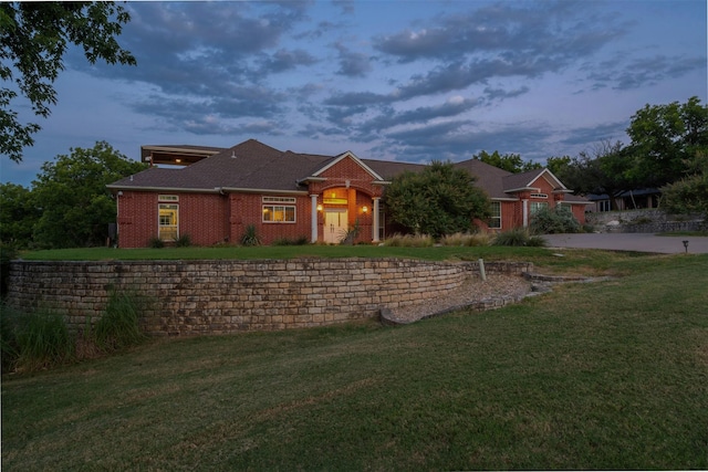 view of front of home with a lawn