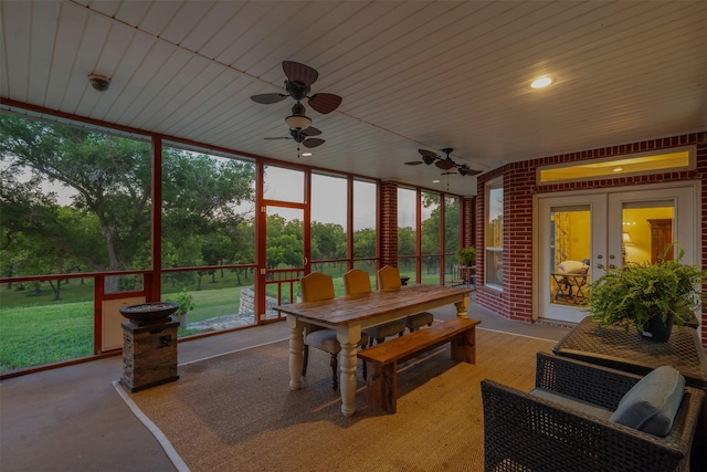 sunroom / solarium with a wealth of natural light and french doors