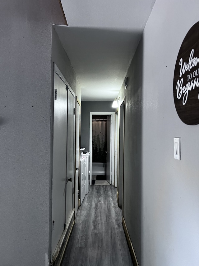 hallway with hardwood / wood-style flooring