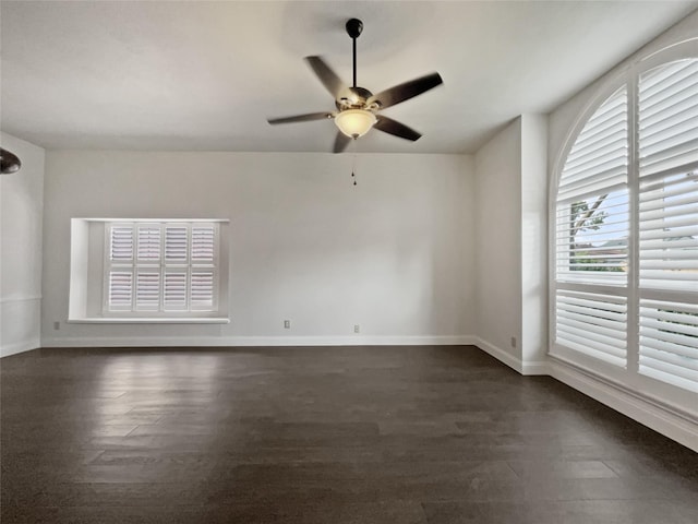 unfurnished room with ceiling fan and dark hardwood / wood-style floors