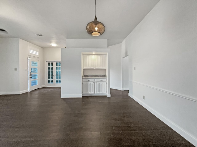 unfurnished living room with french doors