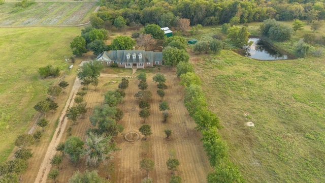 aerial view with a rural view and a water view