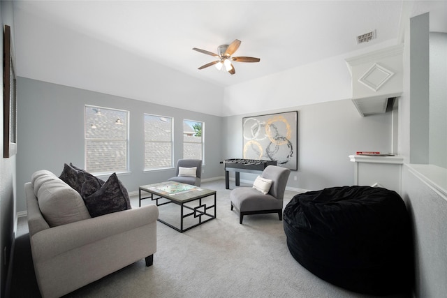 living room featuring light colored carpet and ceiling fan