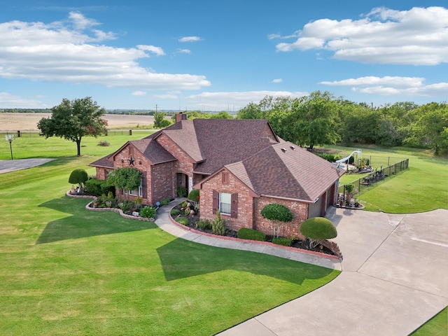 view of front of property with a front lawn and a garage