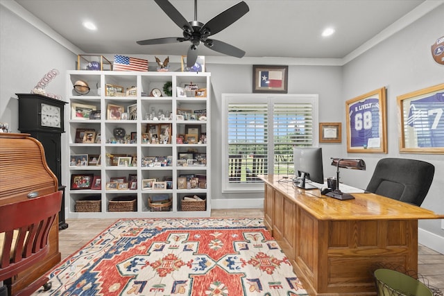 office featuring ceiling fan, light wood-type flooring, and ornamental molding