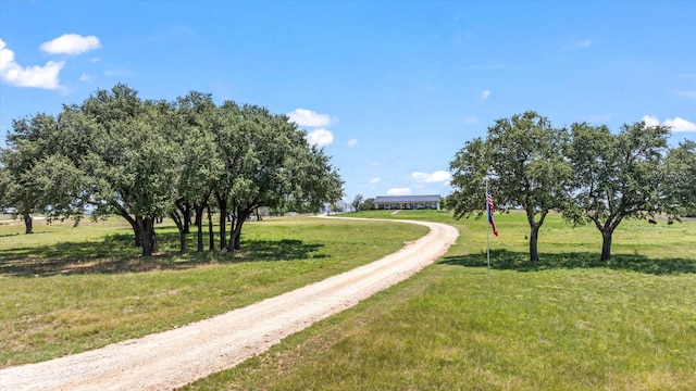 surrounding community with a lawn and a rural view