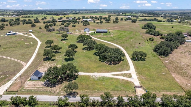 birds eye view of property with a rural view