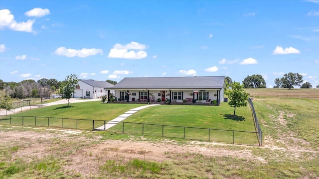 view of front facade featuring a front lawn, covered porch, and a rural view