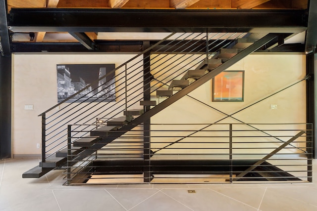 staircase with tile patterned floors