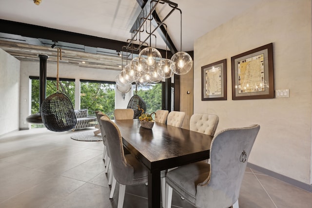 dining room featuring tile patterned flooring and a notable chandelier