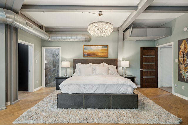 bedroom featuring an inviting chandelier, beam ceiling, and hardwood / wood-style flooring