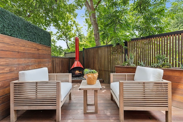 wooden terrace featuring an outdoor hangout area