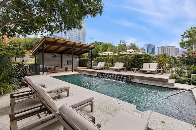 view of pool featuring a patio and pool water feature