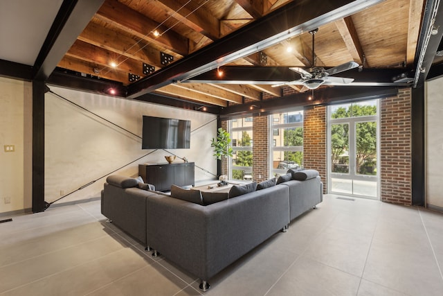 tiled living room with wood ceiling, brick wall, beamed ceiling, and ceiling fan