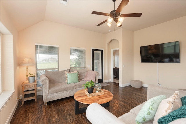 living room featuring ceiling fan and vaulted ceiling