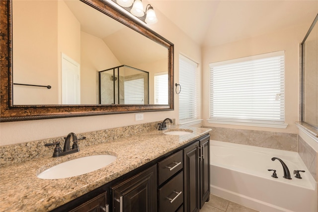 bathroom featuring vanity, tile patterned floors, shower with separate bathtub, and lofted ceiling