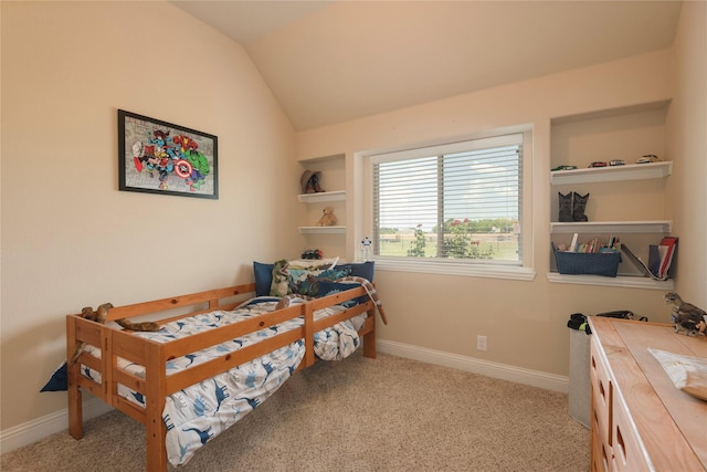 carpeted bedroom featuring lofted ceiling