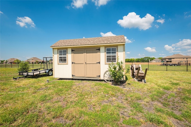 view of outdoor structure with a lawn