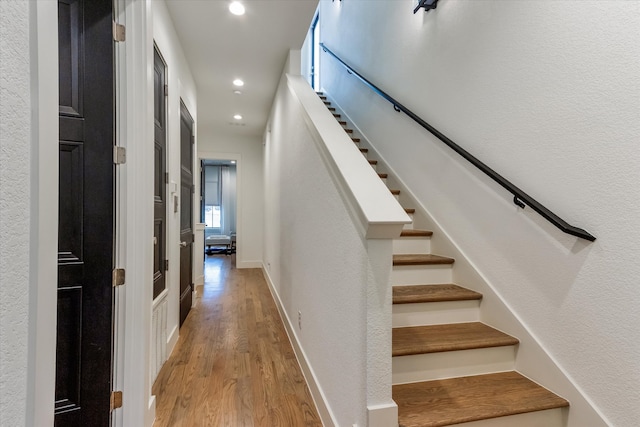 stairs with light wood-type flooring