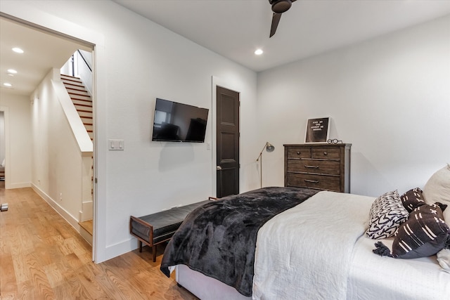 bedroom featuring light hardwood / wood-style flooring and ceiling fan