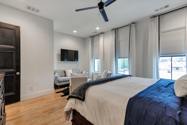 bedroom featuring access to outside, ceiling fan, and light hardwood / wood-style floors