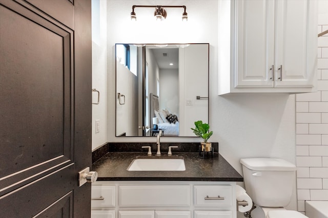 full bathroom with vanity, shower / bathing tub combination, and toilet