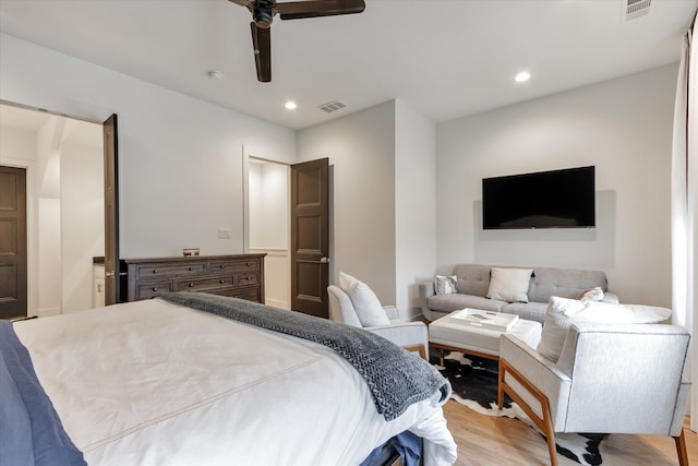 bedroom featuring ceiling fan and light hardwood / wood-style flooring