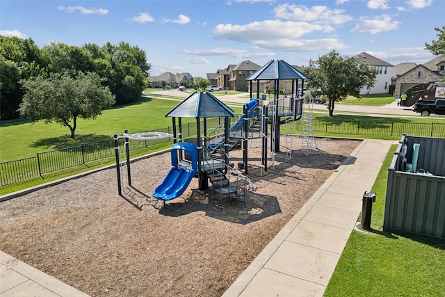 view of playground with a lawn