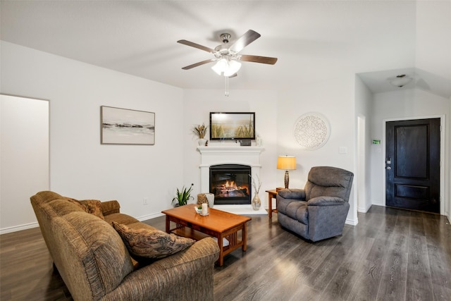 living room featuring ceiling fan and dark hardwood / wood-style floors