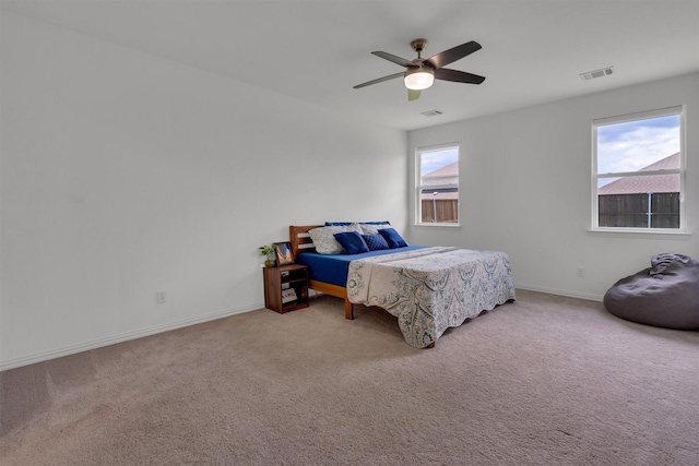 bedroom with ceiling fan and carpet flooring