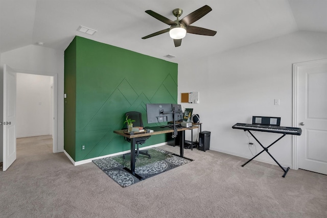 office area with ceiling fan, vaulted ceiling, and light carpet