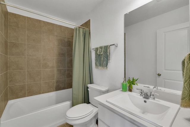 full bathroom featuring toilet, shower / bath combo with shower curtain, and vanity