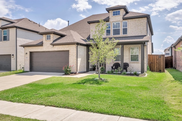 view of front facade with a front lawn and a garage