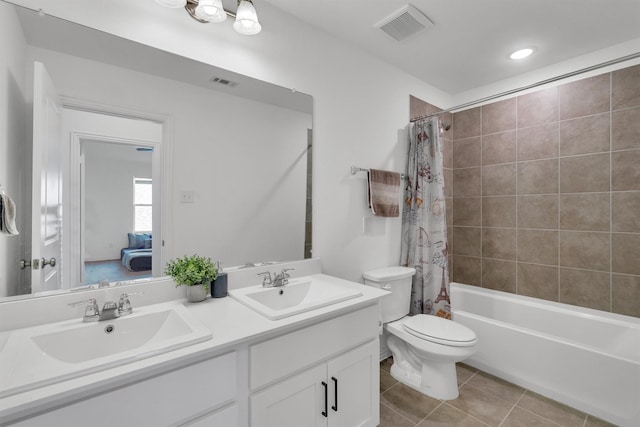 full bathroom featuring toilet, vanity, tile patterned floors, and shower / bathtub combination with curtain