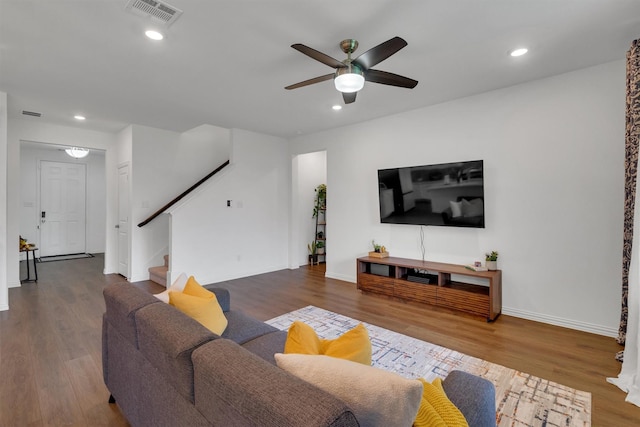 living room with ceiling fan and hardwood / wood-style flooring