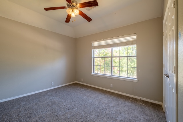 spare room featuring carpet and ceiling fan