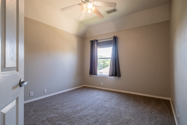 carpeted spare room with lofted ceiling and ceiling fan