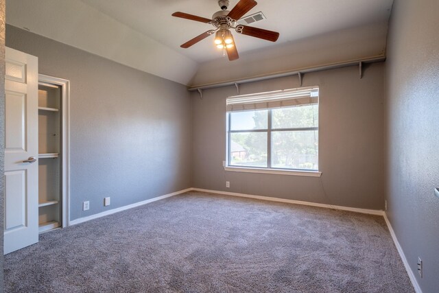 spare room with carpet, lofted ceiling, and ceiling fan